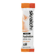 Skratch Labs hydration drink mix packet with orange flavor on a white background