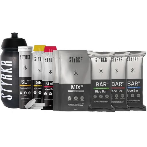 Collection of STYRKA products including a water bottle, energy gels, and rice bars on a white background.